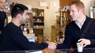 Two men shaking hands after meeting each other.