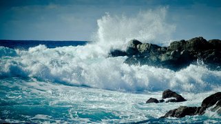 Ocean waves crashing into rocks